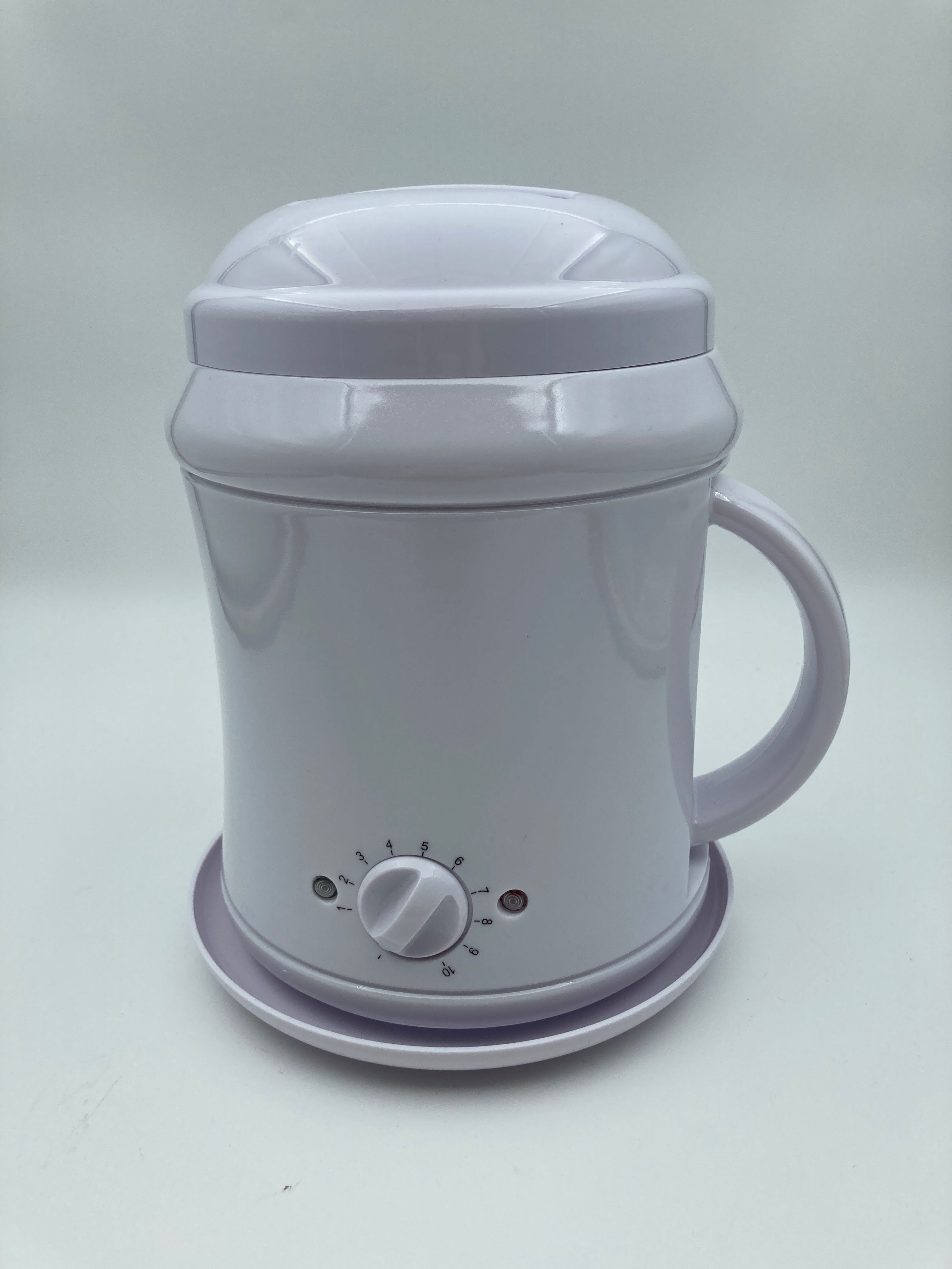 Billede fra myndighedens meddelelse af det tilbagekaldte produkt S Professional S-PRO 1000cc White Wax Heater. Årsag: OKTILTAG.
