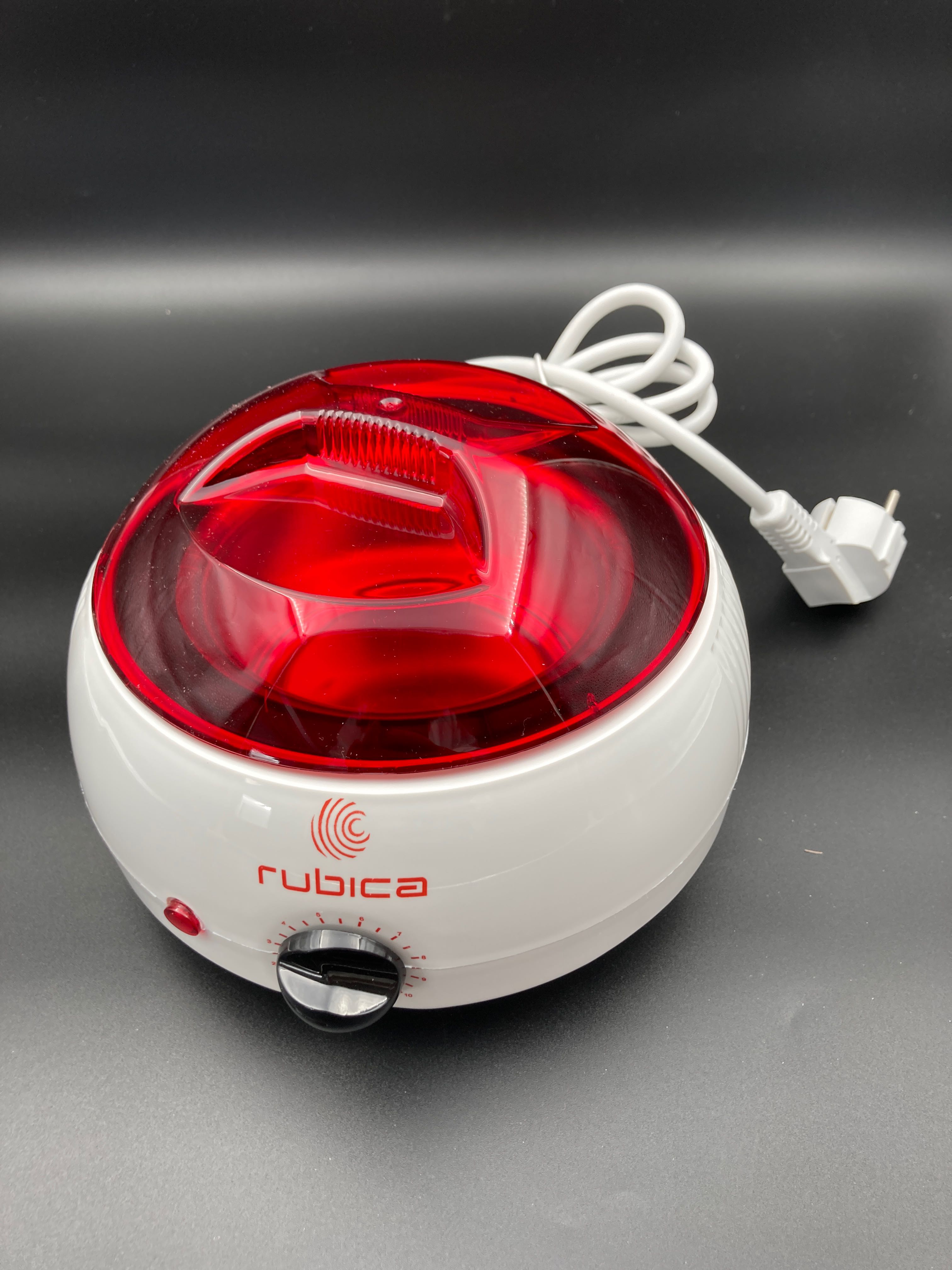 Billede fra myndighedens meddelelse af det tilbagekaldte produkt Rubica Can Wax Heater 400 Ml. Årsag: OVERTRÆD.