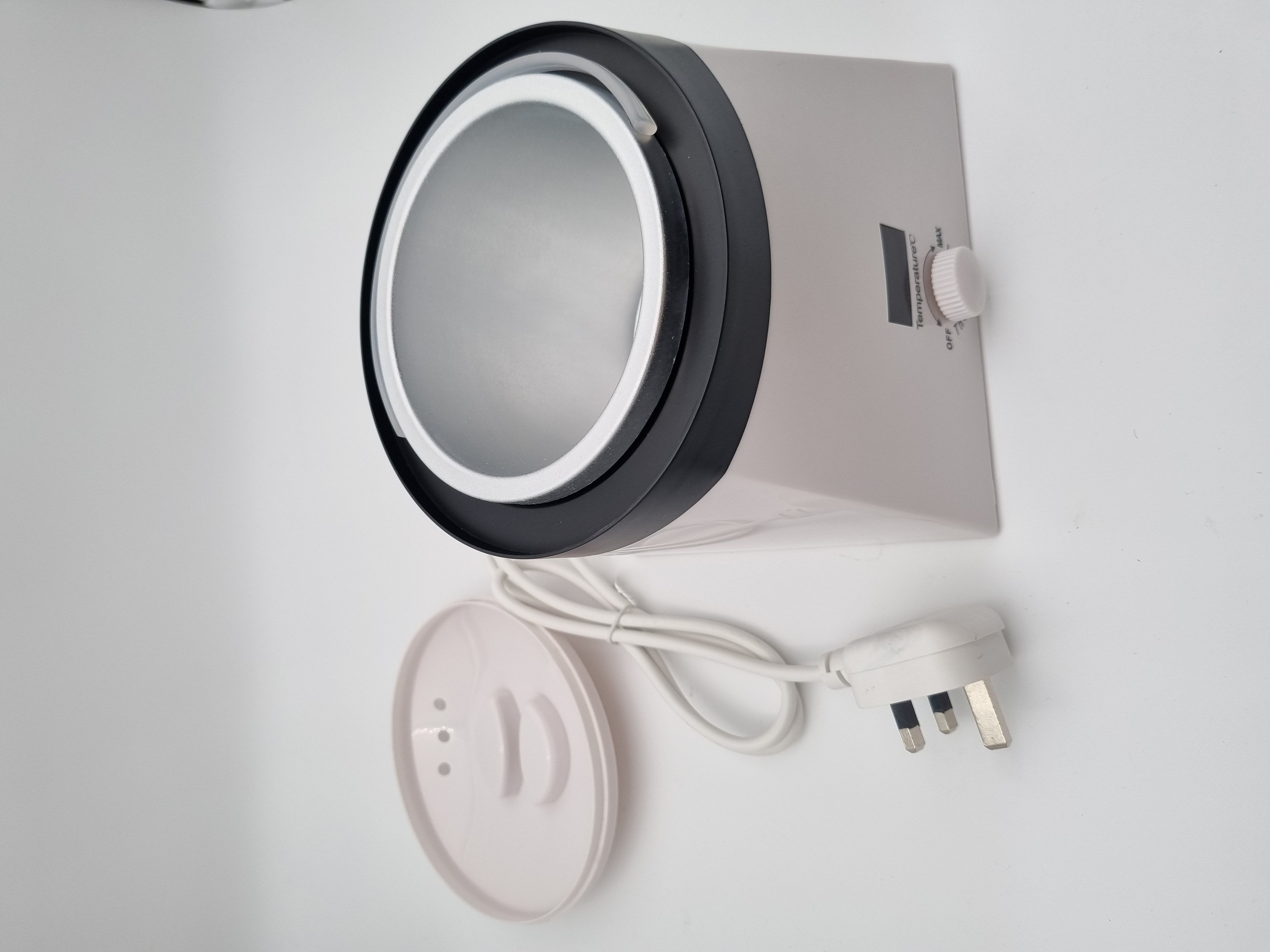 Billede fra myndighedens meddelelse af det tilbagekaldte produkt Posh WAX HEATER. Årsag: OKTILTAG.