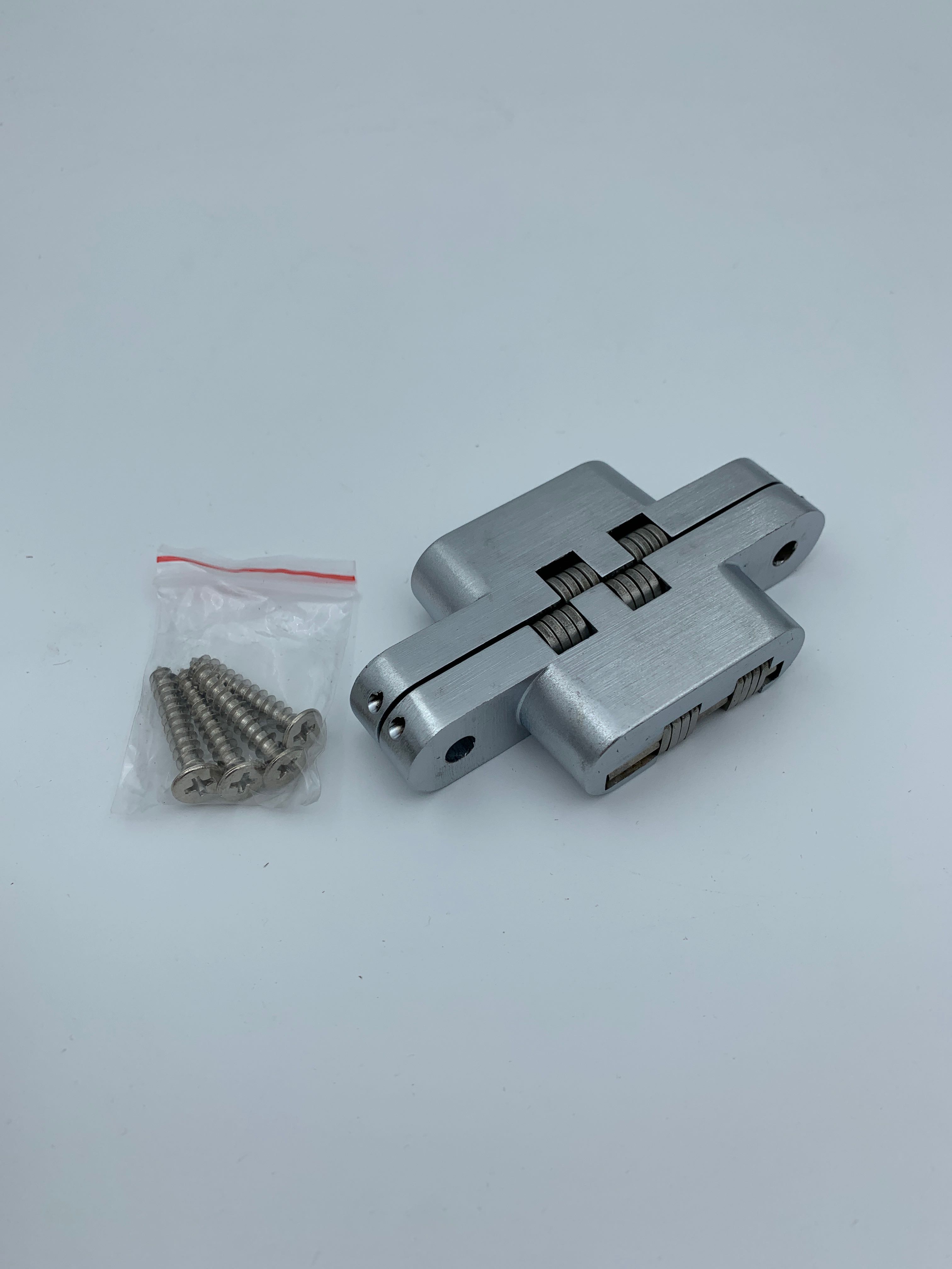 Billede fra myndighedens meddelelse af det tilbagekaldte produkt Concealed Soss Hinge for 28 to 34mm Doors 35kg - Satin Chrome. Årsag: OVERTRÆD.