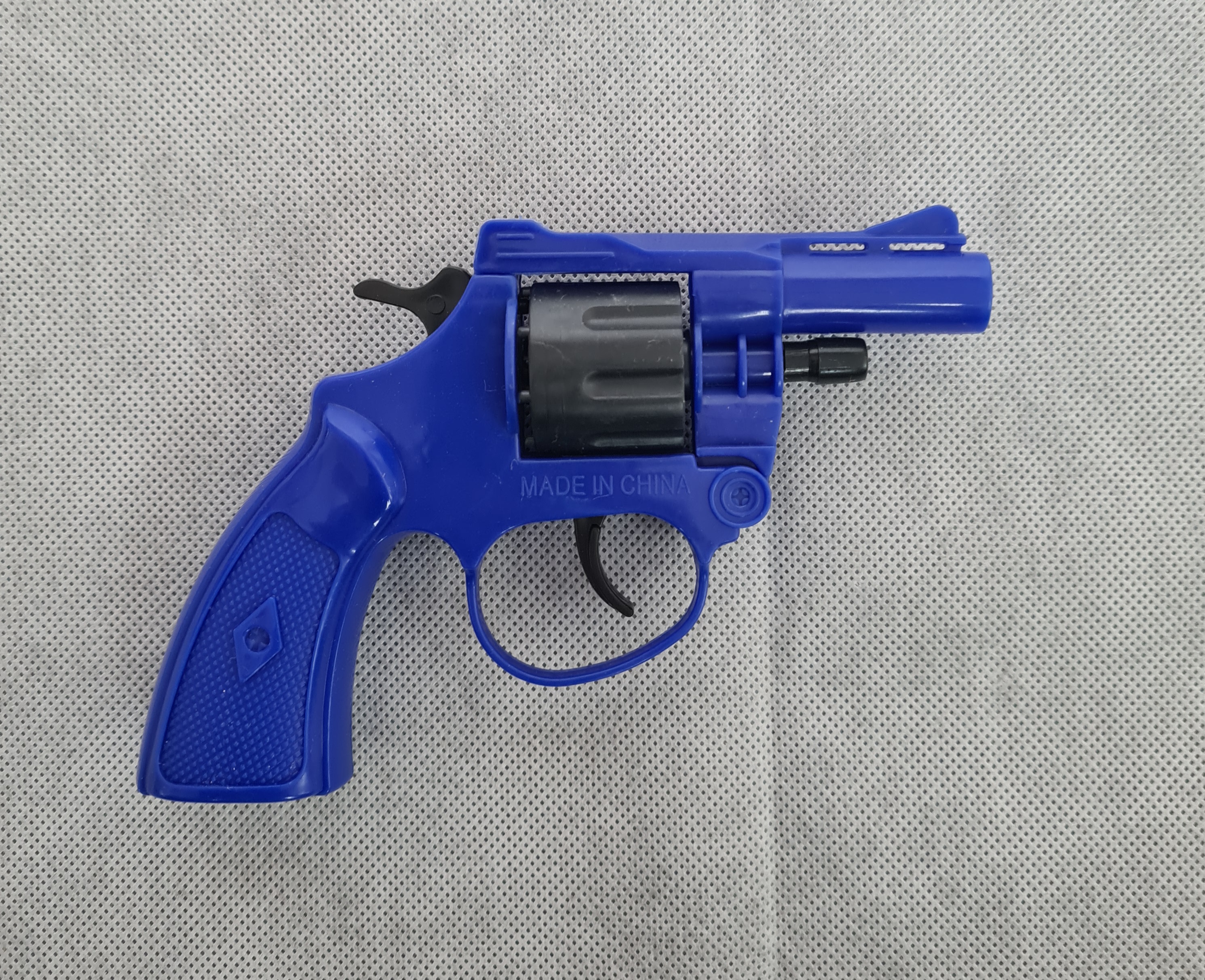 Billede fra myndighedens meddelelse af det tilbagekaldte produkt Detectives Plastic Revolver Cap Gun Toy. Årsag: OVERTRÆD.