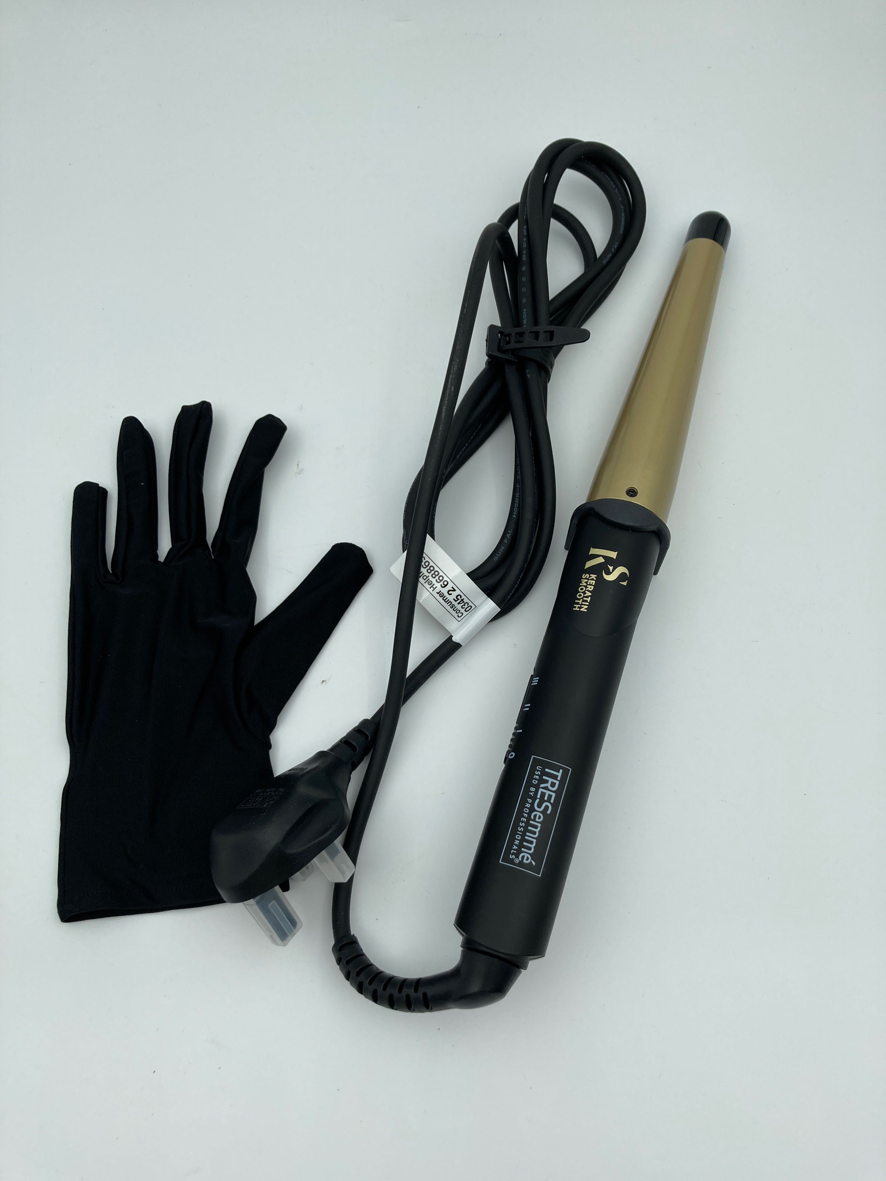 Billede fra myndighedens meddelelse af det tilbagekaldte produkt TRESemme 2804CU Keratin Smooth Salon Shine Waves Styling Wand 3 Heat Settings. Årsag: OVERTRÆD.