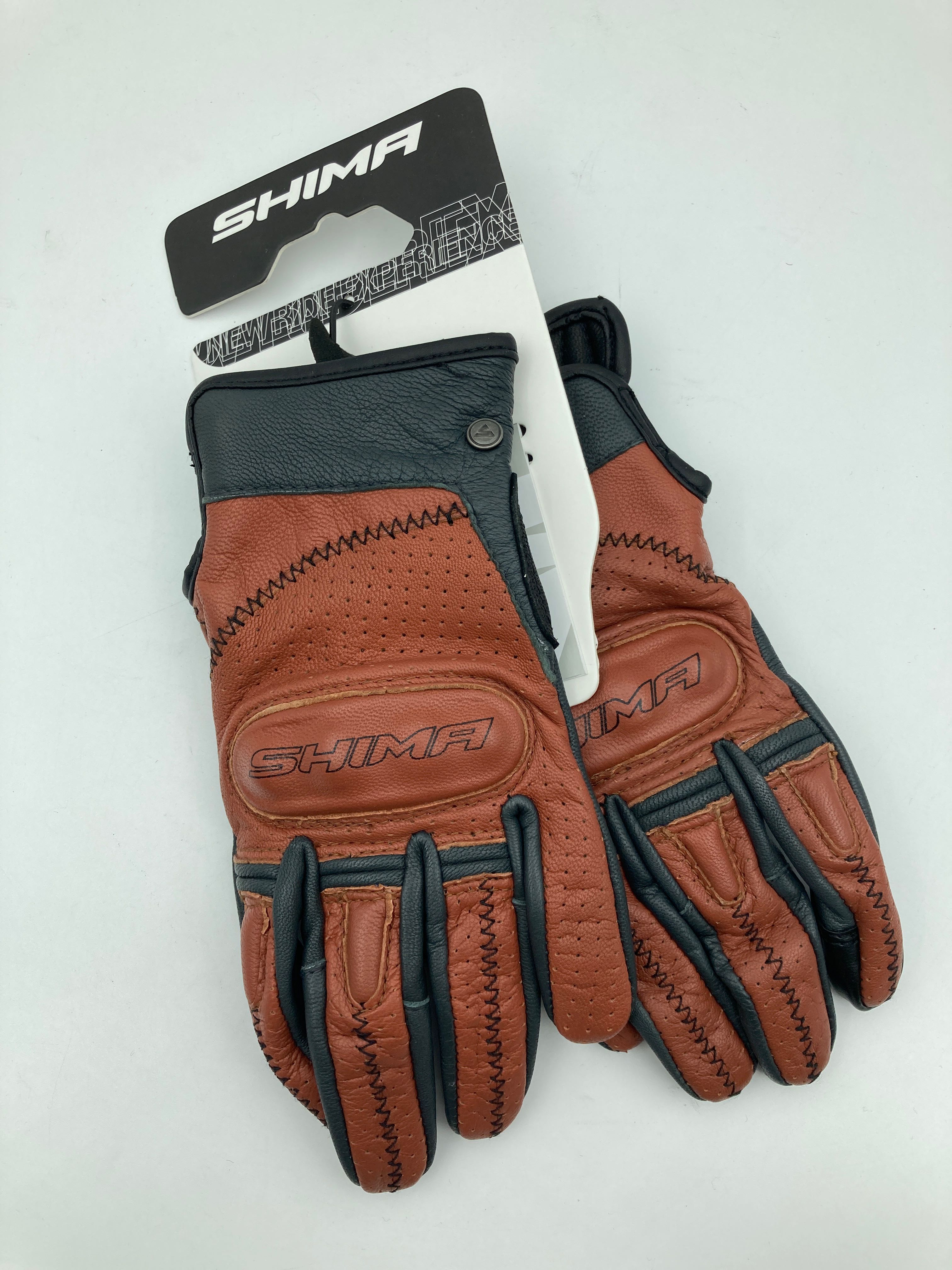 Billede fra myndighedens meddelelse af det tilbagekaldte produkt Shima Caliber Short Vintage Motorcykelhandsker - Brun. Årsag: OVERTRÆD.