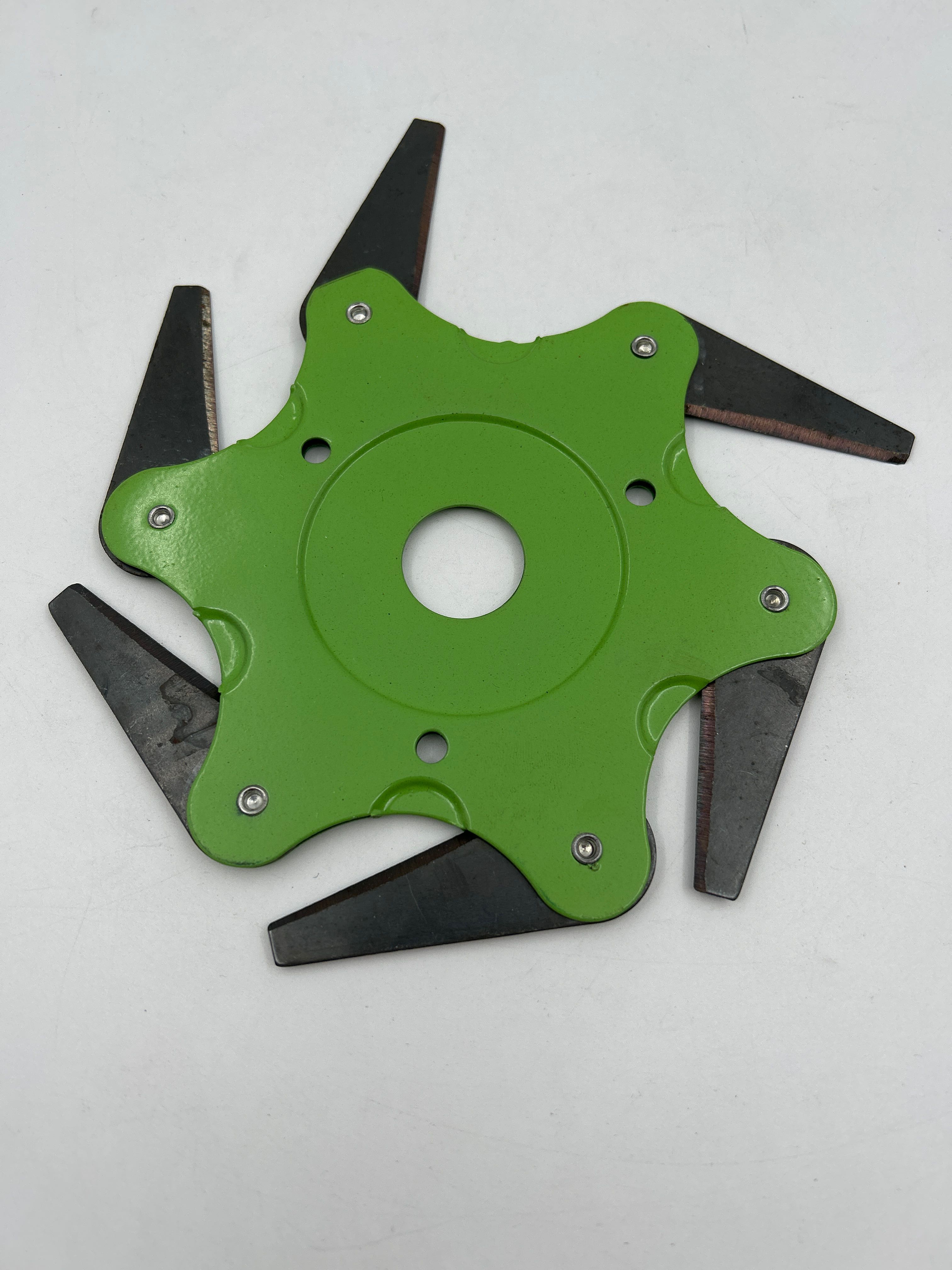 Billede fra myndighedens meddelelse af det tilbagekaldte produkt MALAXA LIANXIAO - Trimmer Head, Universal 6 Teeth Blades Cutter Trimmer Head Double Sided Cutting, Razors 65Mn, Green (Color : Green). Årsag: OKTILTAG.