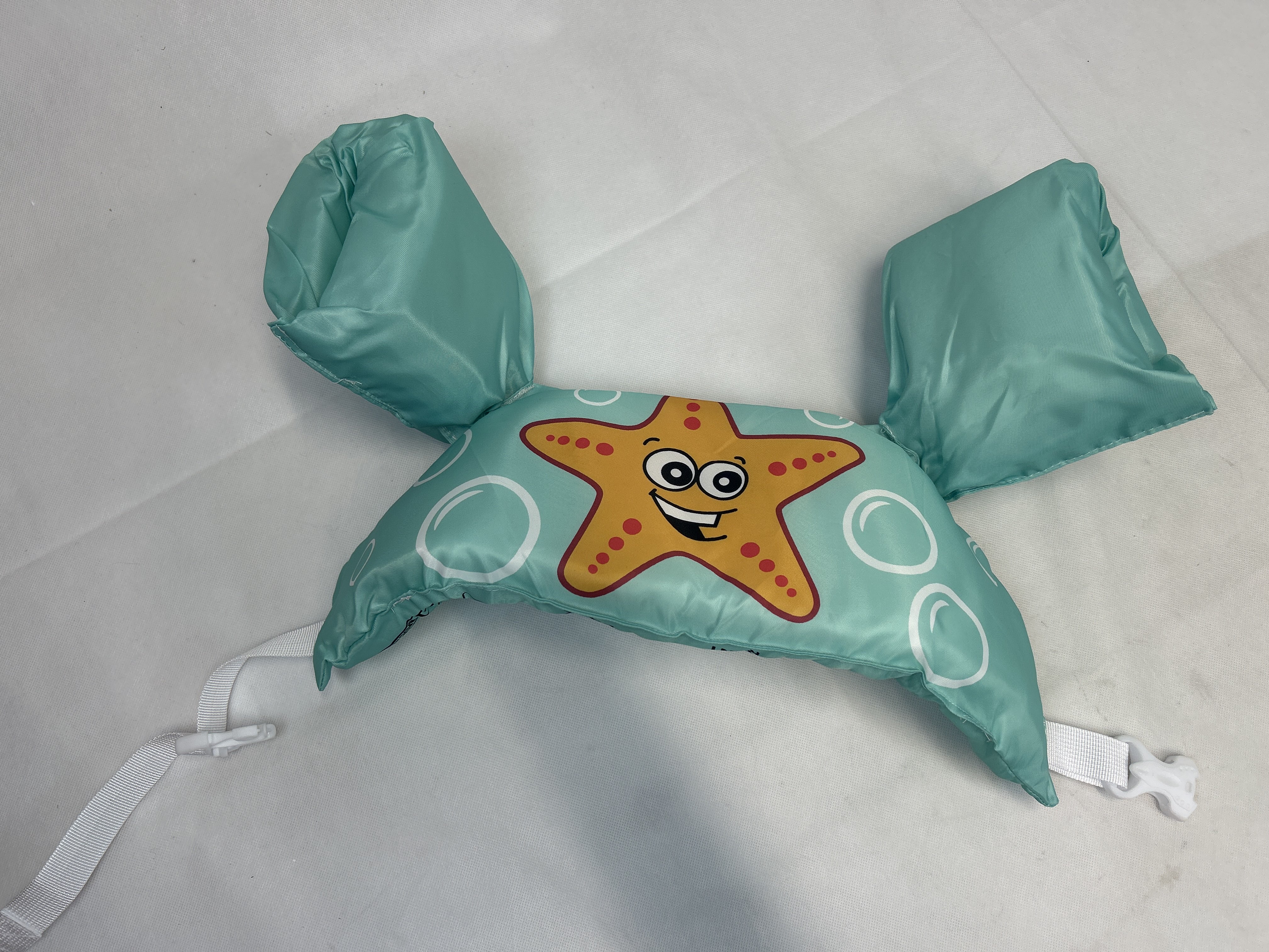 Billede fra myndighedens meddelelse af det tilbagekaldte produkt Custom Logo Pattern Kids Arm Band Floats Safety Learn Swimming Life Jacket EPE Foam puddle jumper baby swimming vest. Årsag: OVERTRÆD.