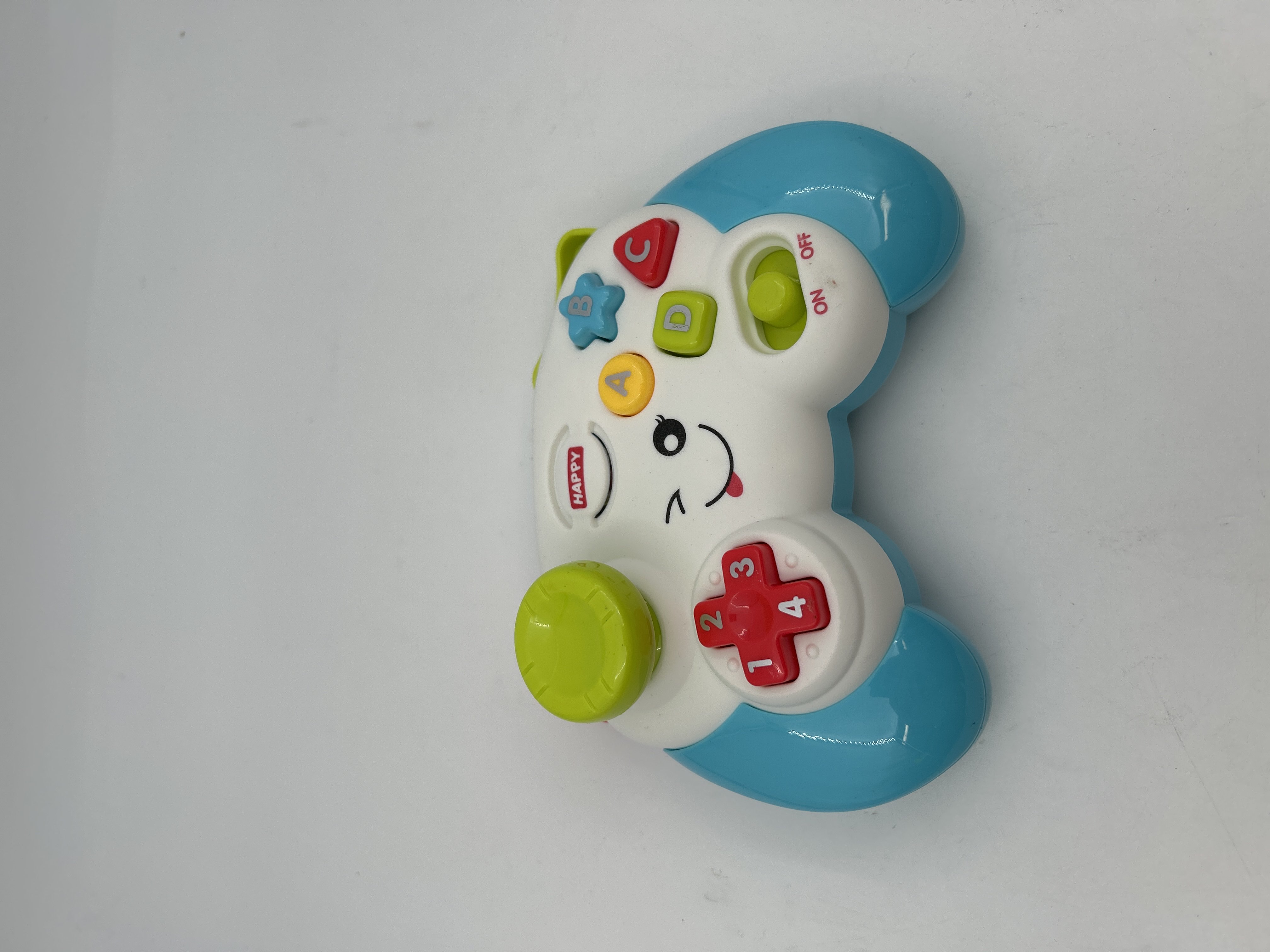 Billede fra myndighedens meddelelse af det tilbagekaldte produkt Multifunktionel ABCD og Numbers Learning Toy med musik og lys til spædbørn og småbørn. Årsag: OVERTRÆD.