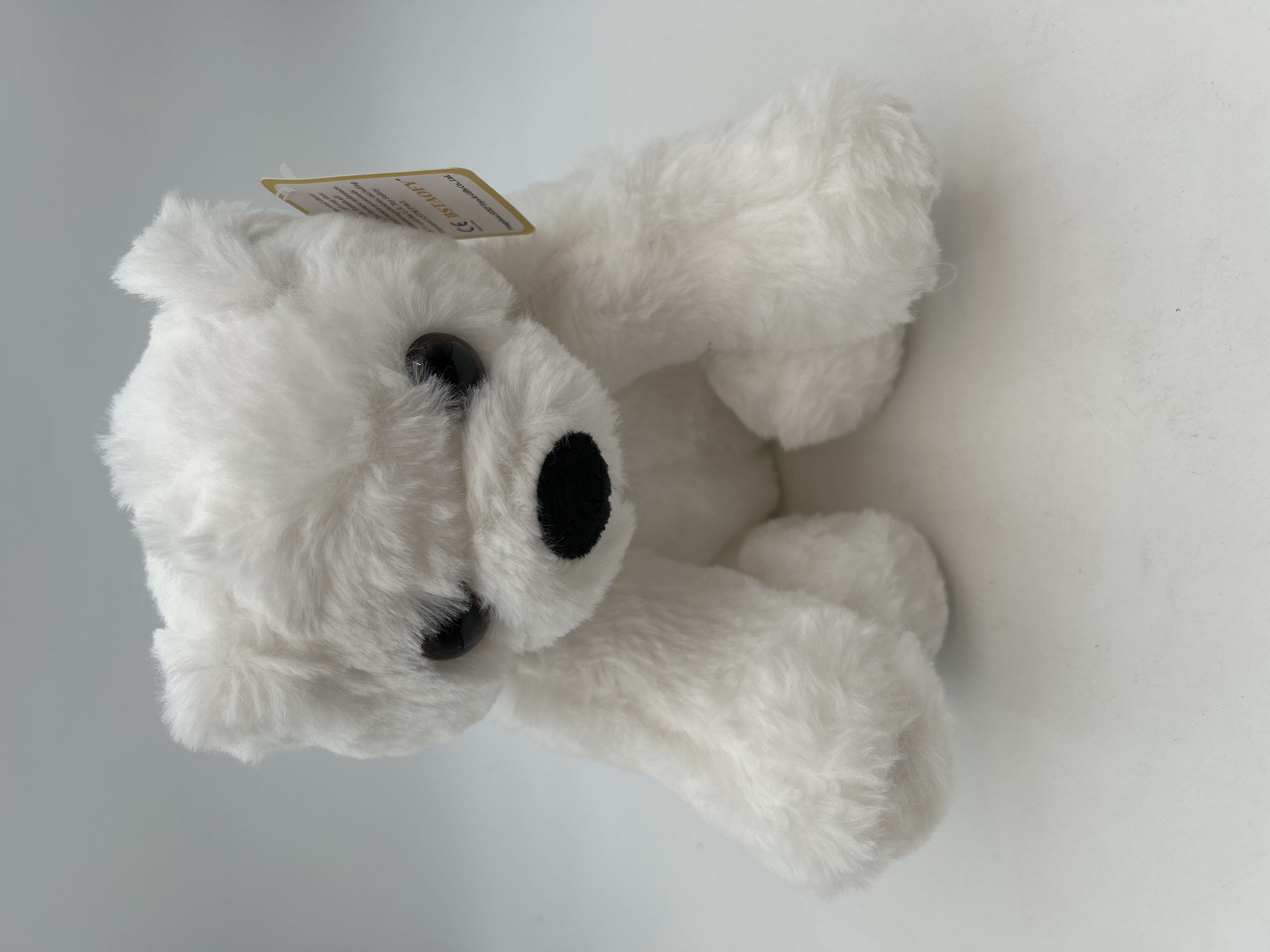 Billede fra myndighedens meddelelse af det tilbagekaldte produkt Bstaofy Glow Polar Bear LED Stuffed Animals Night Light Soft Plush. Årsag: OVERTRÆD.