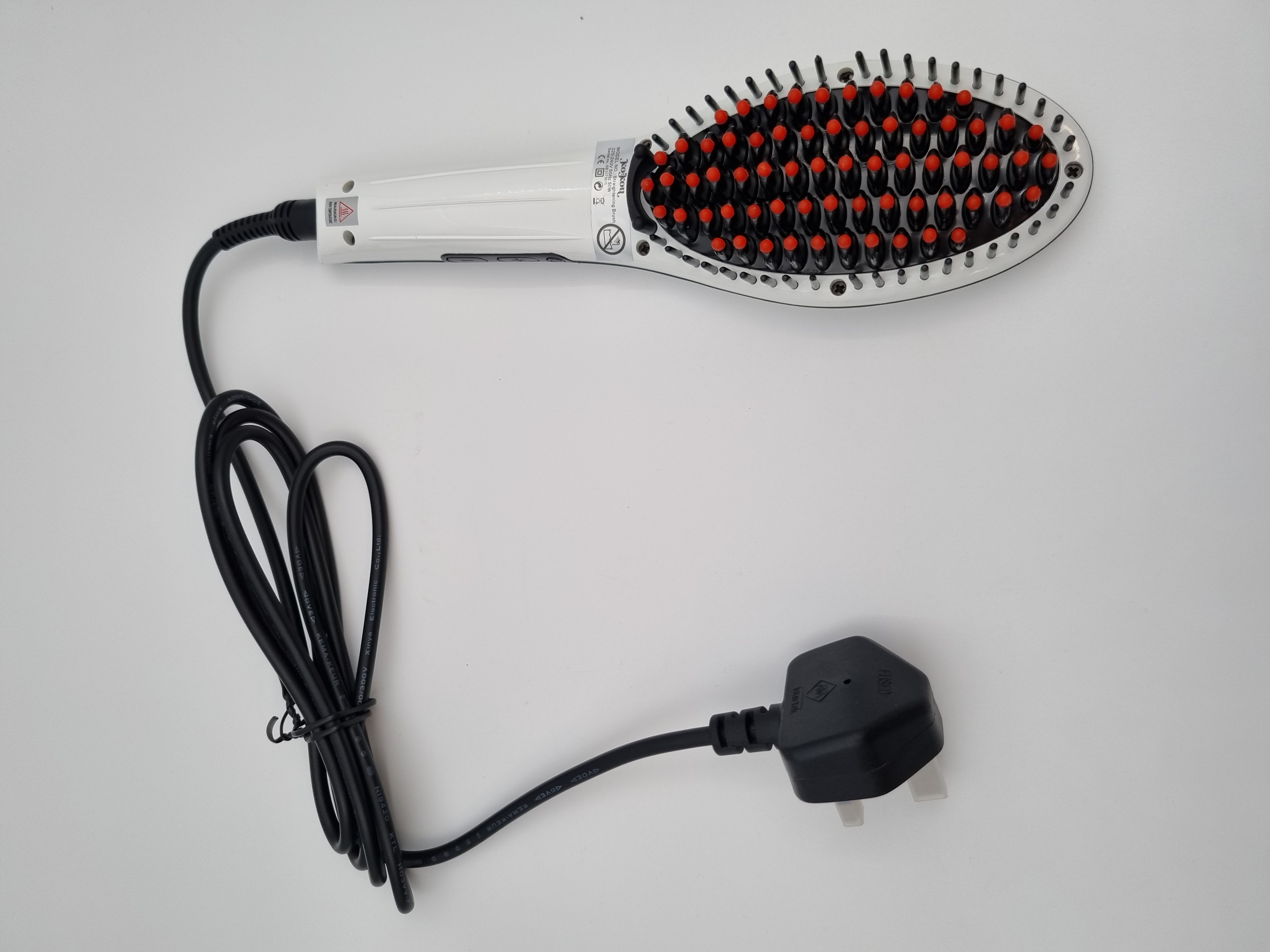 Billede fra myndighedens meddelelse af det tilbagekaldte produkt KOKOU PRO STRAIGHTENING BRUSH PROFESSIONAL HAIR STRAIGHTENERS. Årsag: OKTILTAG.